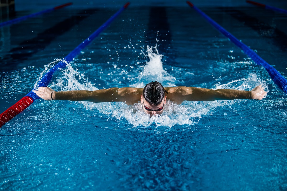Person at the edge of a swimming pool